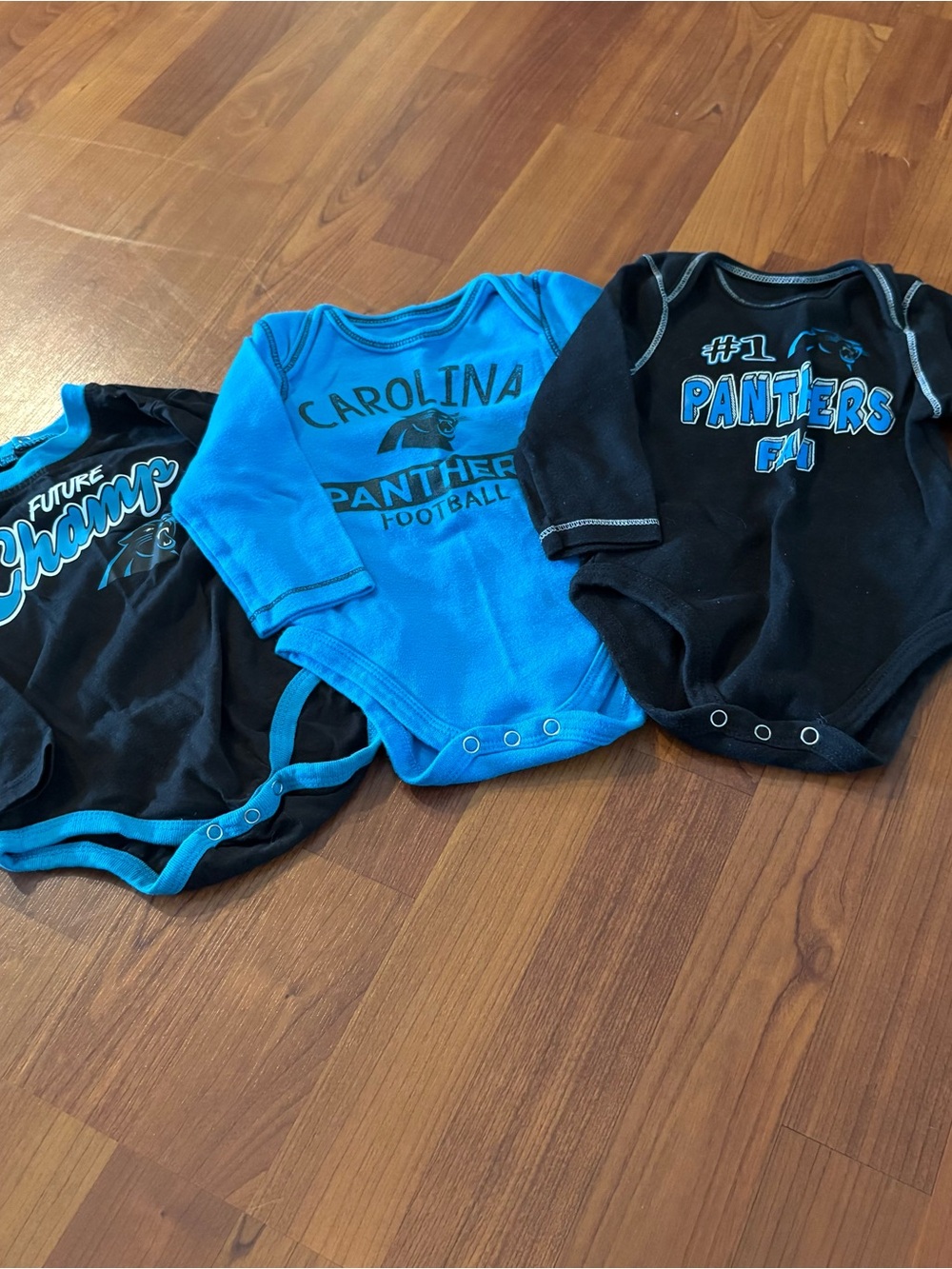 NFL Carolina Panthers Infant Bodysuits in Bright Blue with Black Trim 12 month